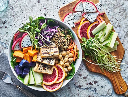 A vibrant bowl of salad featuring fresh vegetables and fruits, promoting optimal immune health through nutritious eating.