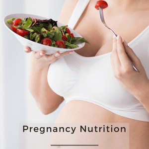 Pregnant woman holding a fresh salad, symbolizing healthy eating for pregnancy nutrition and wellness.